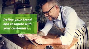 Retailer leaning against a counter.