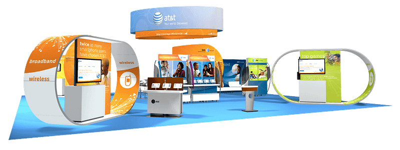 Large trade show booth with multiple touch points and graphics hanging from the ceiling.