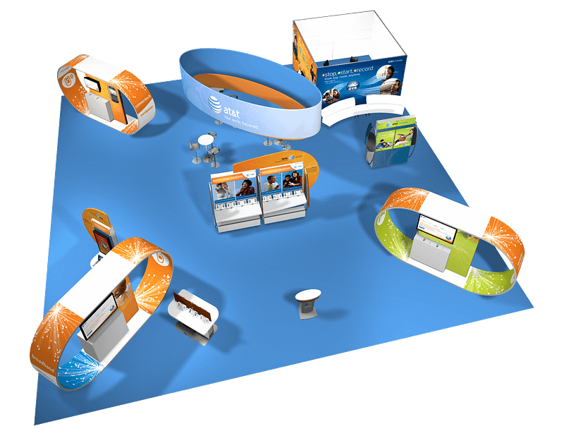 Birds eye view of a large trade show booth with multiple touch points and graphics hanging from the ceiling.